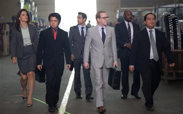 Riz Ahmed as Changez (centre back) behind Kiefer Sutherland as his boss on a trip to the Philippines to make a car plant more productive (and lose jobs).