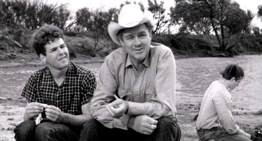Timothy Bottoms as Sonny with Ben Johnson as Sam (in the hat). Sam Bottoms as Billy is in the background.