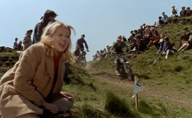 Hayley Mills as Jenny enjoys the motorbike scrambling event that she is taken to by her husband's brother who is a competitor.